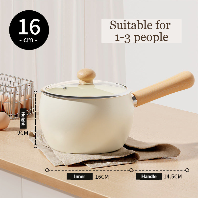 Cute and pretty 16cm white pot with wooden handle and lid on a light surface, solo cooking, Mini pot with Ceremic coating, non-stick.