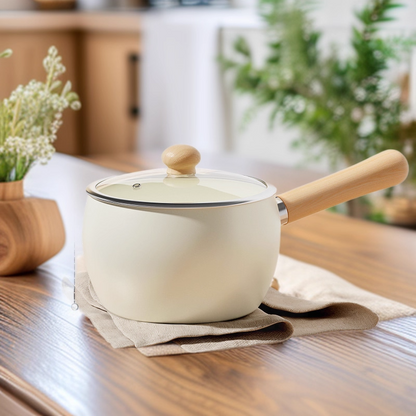 Cute and pretty white pot with wooden handle and lid on a light surface, solo cooking, Mini pot with Ceremic coating, non-stick.